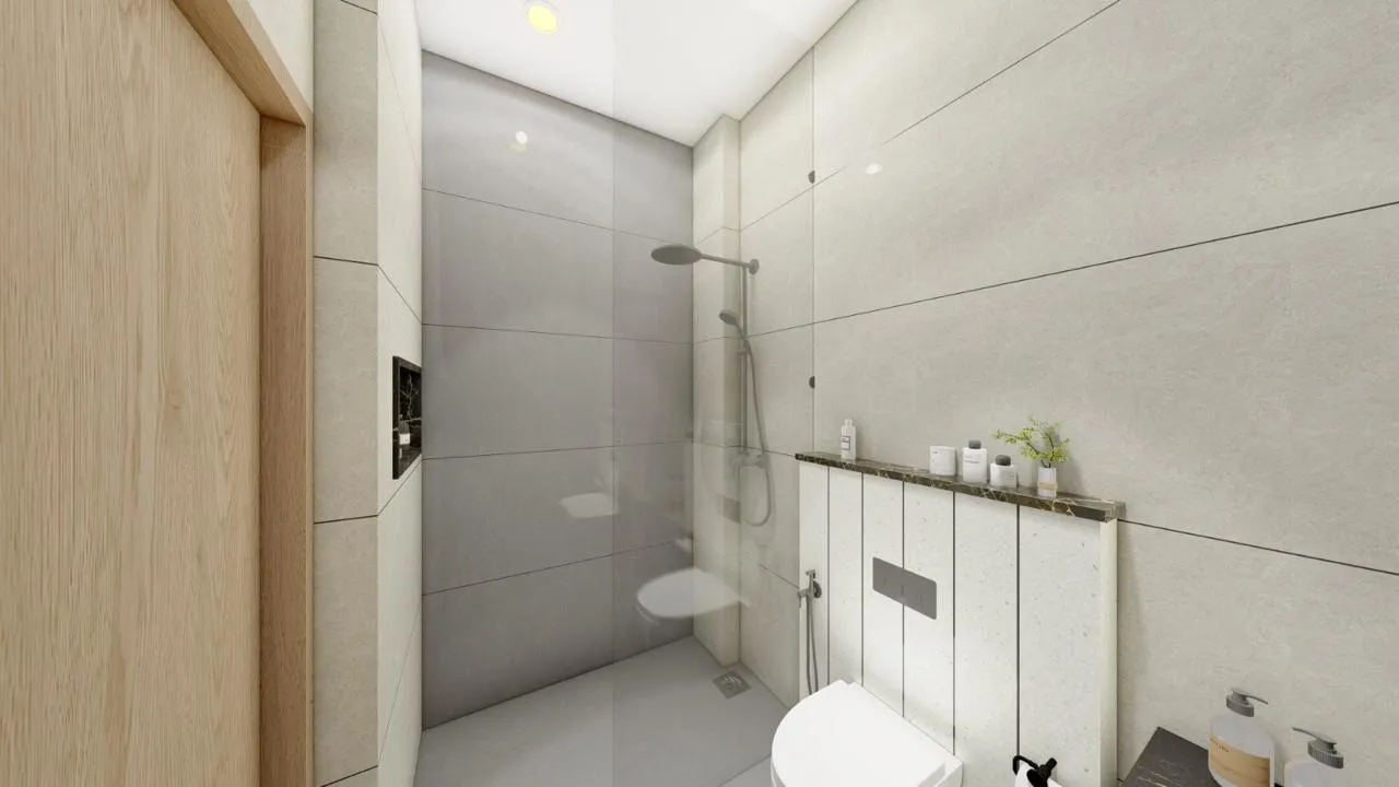 A guest bathroom at JS Grand, a Kumbakonam wedding hall with rooms on-site — 5